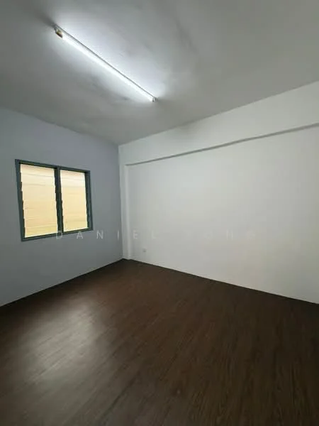 Room features: light wood laminate flooring, white painted walls, two green casement windows, fluorescent ceiling lights, no visible furniture or decor; style: minimalist.