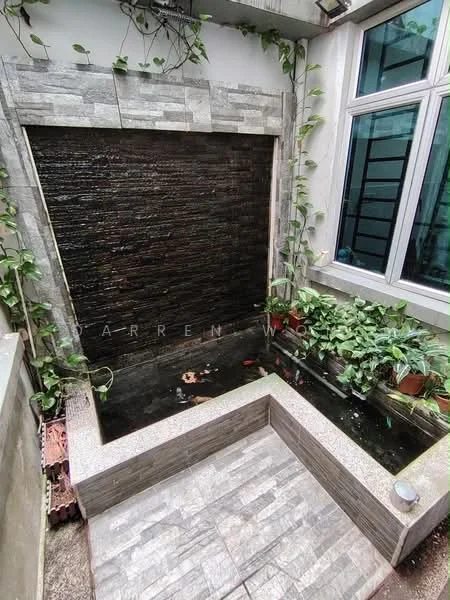 Exterior features: water feature with stone cladding, vertical water wall, surrounding greenery with climbing plants, stone-paved flooring, small pond with fish, planters with foliage; style: modern.