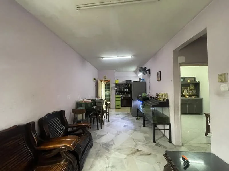Living features: light purple painted walls, marble flooring, ceiling lights, wooden sofa set, wooden dining table with chairs, glass display cabinet, kitchen area visible in background, open layout.