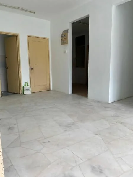 Room features: white painted walls, marble tile flooring, two wooden doors, one open doorway, light from window, neutral color scheme; style: minimalist.