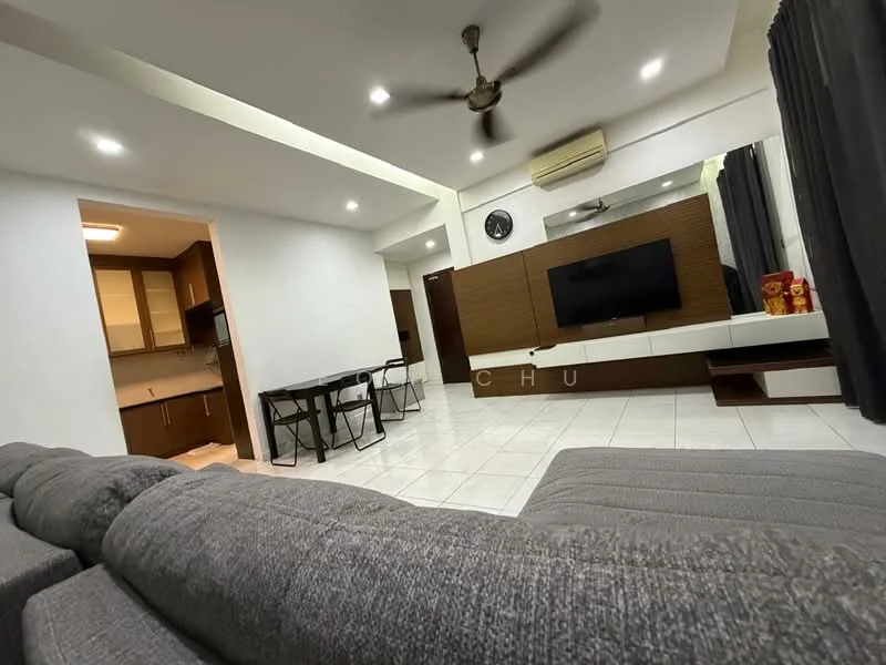 Living features: grey fabric sectional sofa, wall-mounted TV, white TV console, recessed downlights, 5-blade ceiling fan, white tiled flooring, decorative wall paneling, large window with grey curtains, dining table with black chairs, air conditioning unit; style: modern. Kitchen features: brown wooden cabinetry, stainless-steel sink, built-in oven, ceramic cooktop, white tiled backsplash, grey countertop, refrigerator, open layout to living area; style: modern.