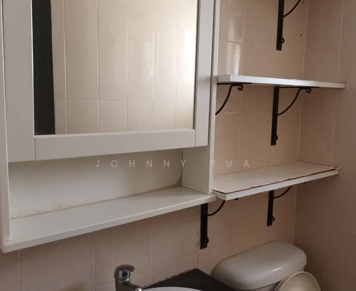 Bathroom features: white tiled walls, black countertop, white toilet, mirror with white frame, open shelving with black brackets, light-colored wall tiles.