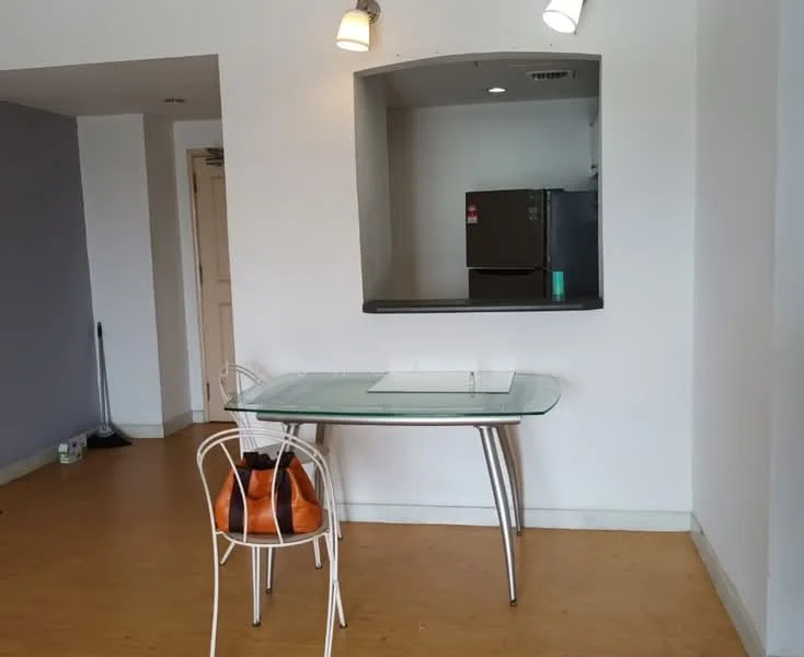 Room features: glass dining table, white metal dining chairs, light wood flooring, grey accent wall, white painted walls, refrigerator, recessed lighting, open kitchen counter, floor-to-ceiling windows; style: modern.