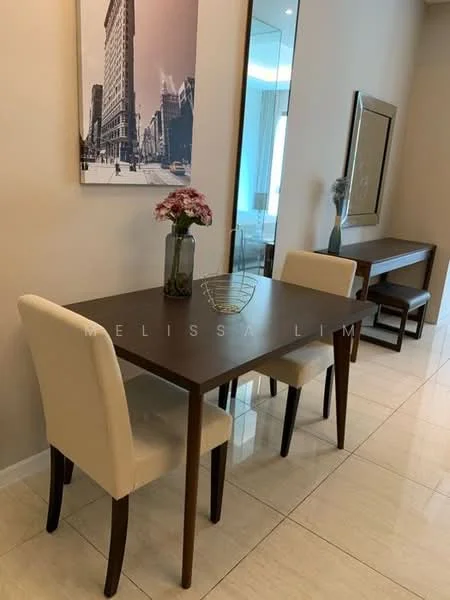 Dining features: wood dining table, 2 upholstered dining chairs in cream, framed artwork on wall, vase with flowers on table, mirror on wall, white painted walls, glossy tile flooring, natural light from window; style: modern.