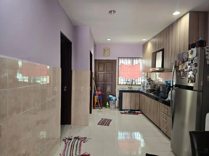 Kitchen features: purple painted walls, cream tiled backsplash, black countertop, stainless-steel fridge, built-in cabinets with wood finish, sink, kitchen appliances on countertop, floor tiles, window with grid, decorative wall art, area rug, cleaning supplies visible; style: modern.
