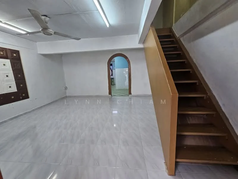 Room features: white painted walls, glossy ceramic tile flooring, ceiling fan, arched doorway, staircase with wooden steps, fluorescent ceiling lights, open layout, no visible furniture; style: minimalist.