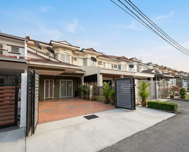 Exterior type: linked terrace house; features: two-storey linked terrace, grey painted facade, tiled porch area, metal gate, paved driveway, manicured garden with plants, satellite dishes on roof, fenced front yard, front entrance with security grille, surrounded by residential street; style: modern.