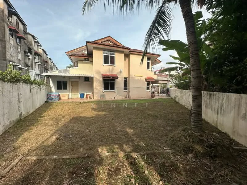 Exterior type: detached bungalow; features: two-storey building, cream painted facade, red tiled roof, surrounded by grass lawn, palm tree in foreground, fenced yard, windows with red awnings, backyard space, concrete wall, adjacent residential buildings; style: modern.