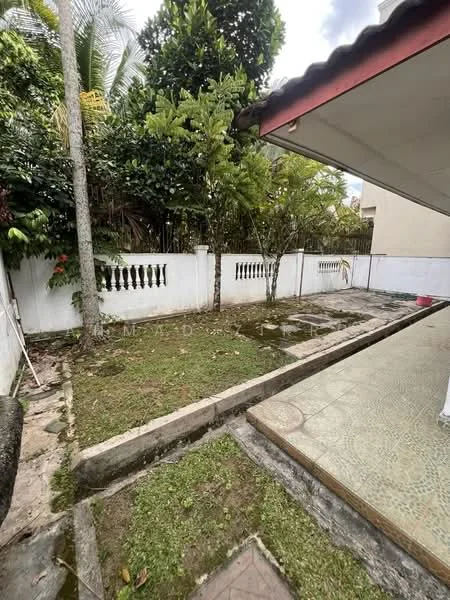 Exterior features: manicured lawn, tropical landscaping, paved walkway, white painted fence, garden area, surrounded by greenery, patio area.