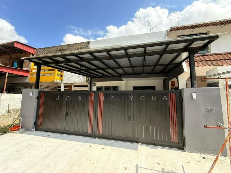 Exterior type: linked terrace house; features: metal gate with horizontal slats, car porch with roof, concrete driveway, white painted walls, overhead awning, visible residential neighborhood, two-storey house in background, clear blue sky; style: modern.