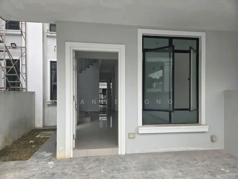 Exterior features: grey painted walls, large window with black frame, tiled flooring, entrance with door, staircase visible in background, surrounding unfinished landscaping; style: modern.