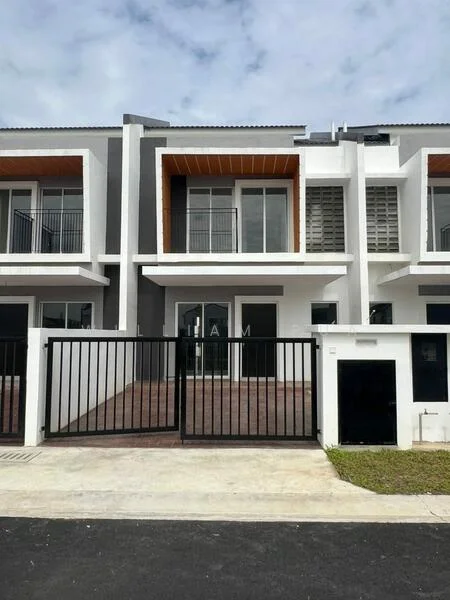 Exterior type: linked terrace house; features: white painted facade, wooden accent on upper level, large glass windows, balcony on upper level, brick paved front yard, black metal gate, concrete driveway, two-storey structure, flat roof, surrounded by grass, modern architectural design; style: modern.