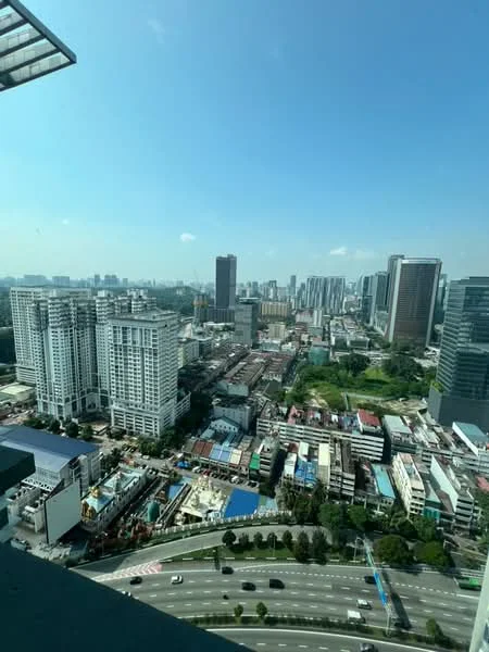 Exterior type: high-rise condominium; features: city skyline view, surrounded by urban development, high-rise buildings, mixed-use area, roadway visible, green spaces, construction site in view; style: modern.