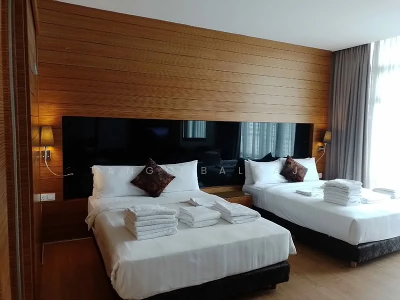 Bedroom features: two queen-size beds with white bedding, wooden accent wall, floor-to-ceiling windows with sheer curtains, wall-mounted TV, two bedside lamps, dark wood flooring, decorative cushions on beds, stacked towels on beds; style: modern.