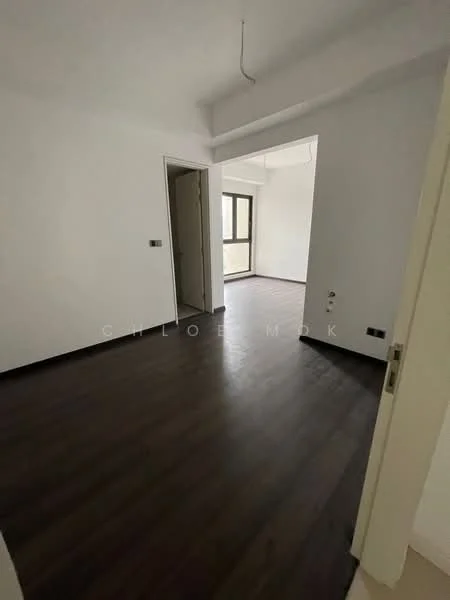 Room features: dark wood laminate flooring, white painted walls, ceiling with exposed beams, large window with view to the outside, doorway leading to another room, light fixture hanging from ceiling, power outlet on wall, baseboard trim; style: modern.