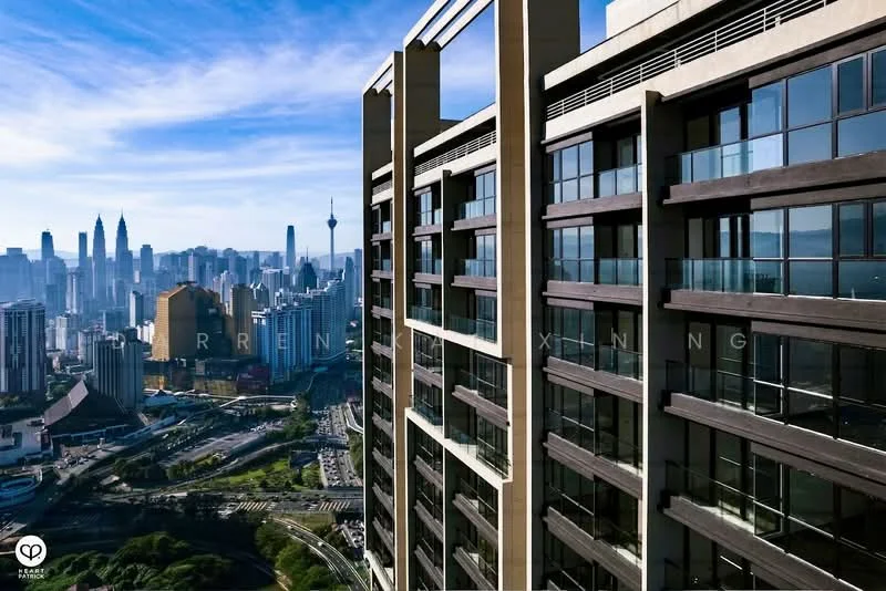 Exterior type: high-rise condominium; features: glass curtain wall, recessed balconies, approximately 30-storey high-rise, surrounded by city skyline, view of Petronas Twin Towers, view of KL Tower, modern architectural design; style: modern.