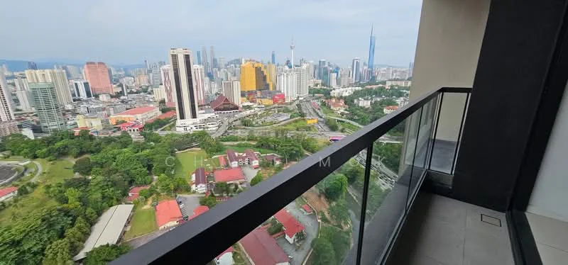 Room features: glass railing, city skyline view, outdoor flooring, balcony space, urban landscape, greenery below, high-rise building, concrete wall; style: modern; view: city.