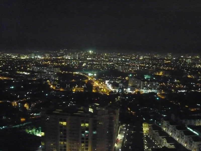 Exterior type: high-rise condominium; features: city skyline view, nighttime lighting, surrounding urban landscape, distant city lights, high-rise buildings in view, green spaces visible, streetlights, water bodies reflecting lights; style: modern.