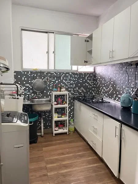 Kitchen features: black countertop, white cabinetry, mosaic tile backsplash, stainless-steel sink, gas stove with 4 burners, built-in washing machine, open shelving unit, wooden flooring, window for natural light; style: modern.