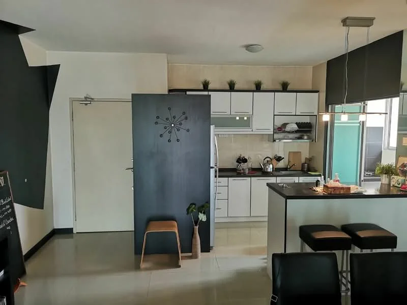 Kitchen features: white cabinetry, black countertop, stainless-steel appliances, built-in oven, freestanding range oven, single-bowl stainless-steel sink, chrome pull-down faucet, tile backsplash, recessed downlights, bar stools, open shelving, decorative plants, kitchen island, cream walls, grey accent wall; style: modern.
