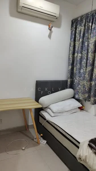 Bedroom features: single bed with grey upholstered headboard, white bedding, wooden desk with light-colored finish, curtains with floral pattern, wall-mounted split AC unit, light-colored tiled flooring, white painted walls, power outlet visible on the floor; style: minimalist.