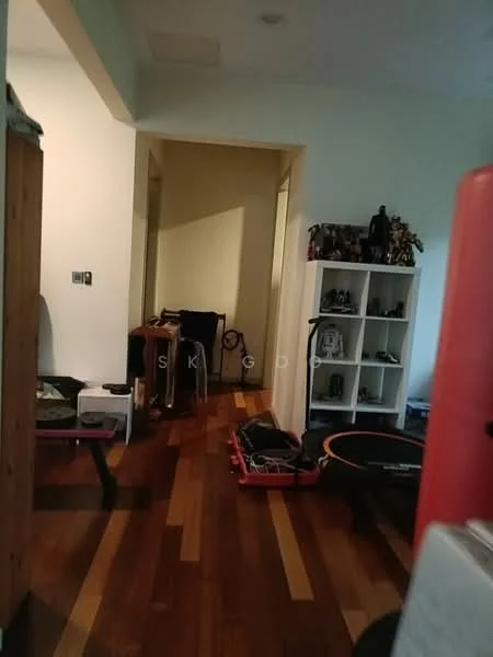Room features: wooden flooring, white walls, doorway leading to another room, shelving unit, clothes drying rack, exercise equipment, various items on the floor.