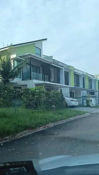 Exterior type: linked terrace house; features: two-storey building, green accent facade, horizontal louvered windows, flat roof, manicured lawn, paved driveway, surrounded by greenery, balconies on upper floor, garage space visible, modern architectural design; style: modern.