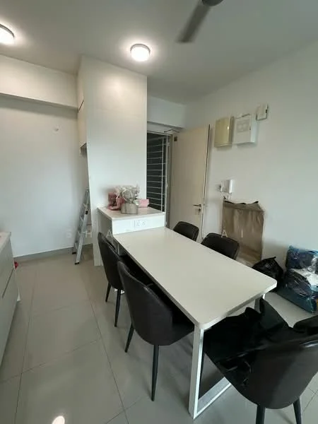 Dining features: white dining table, black dining chairs, light grey tiled flooring, white cabinetry, recessed ceiling lights, wall-mounted air conditioning unit, door leading to hallway, decorative items on table, ladder in corner, neutral painted walls; style: modern.