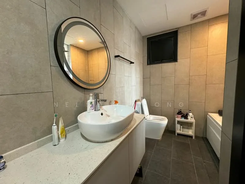 Bathroom features: large round mirror, white vessel sink, chrome faucet, white cabinetry, grey tile flooring, grey wall tiles, toilet, bathtub, black wall-mounted shelf, window, recessed lighting; style: modern.