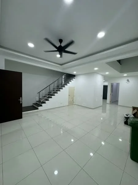 Room features: white painted walls, polished ceramic tile flooring, tray ceiling, recessed LED downlights, 5-blade ceiling fan, staircase with metal railing, open space layout, door leading to another room, green trash bin, furniture in the corner; style: modern.
