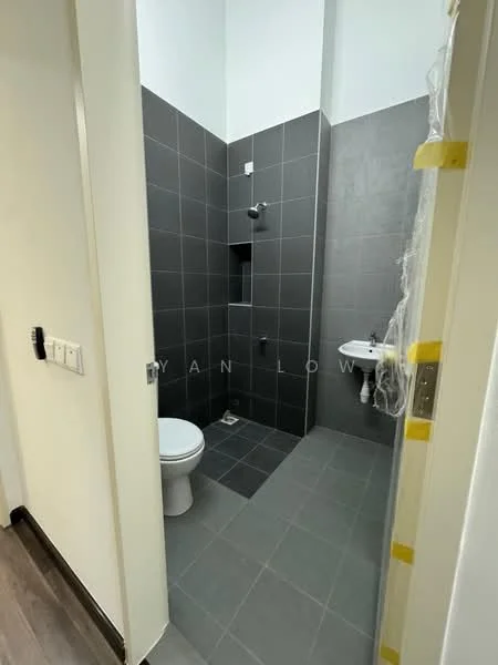 Bathroom features: grey tiled walls, grey tiled flooring, walk-in shower with glass partition, chrome shower head, wall-mounted toilet, sink with pedestal, single basin, toilet paper holder, built-in shower niche; style: modern.
