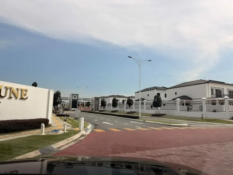 Exterior type: gated community; features: white painted facade, modern architectural style, manicured lawn, paved driveway, street lighting, security gate, surrounded by greenery, multiple residential units, curved road layout, fence surrounding the community; style: modern.