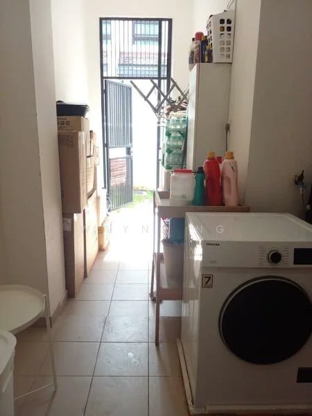 Laundry features: front-load washing machine, white cabinetry, tile flooring, storage boxes, cleaning supplies, open door leading outside, shelving unit, bottles of detergent.