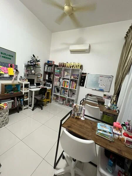 Study features: white painted walls, white ceiling, tile flooring, 1 wall-mounted split AC, 5-blade ceiling fan, 2 study desks with wooden tops, white bar stools, bookshelves filled with books and trophies, corkboard with notes and photos, decorative plants, wall-mounted calendar, curtains, stationery and craft supplies on desks; style: modern.