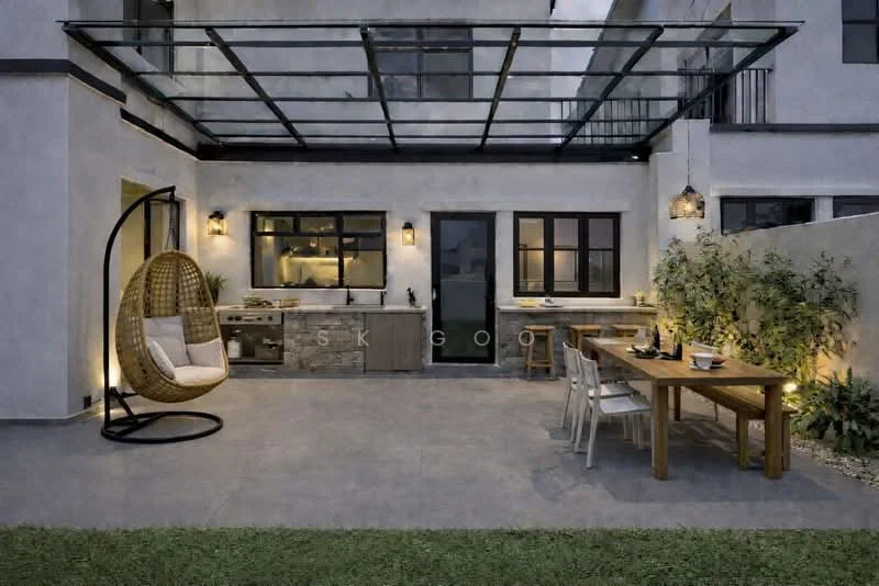 Exterior features: outdoor dining table, wooden dining chairs, hanging egg chair, outdoor kitchen area, stone countertop, wall-mounted outdoor lighting, glass roof structure, paved flooring, greenery along the wall, manicured lawn; style: modern.