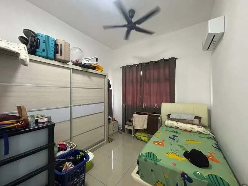 Bedroom features: single bed with patterned bedding, upholstered headboard, built-in wardrobe with sliding doors, ceiling fan, wall-mounted split AC unit, window with dark curtains, tiled flooring, decorative items on top of wardrobe, laundry basket, small table with items, cluttered space.
