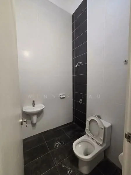 Bathroom features: white ceramic toilet, wall-mounted sink, chrome faucet, black tiled accent wall, white tiled walls, black floor tiles, shower head, toilet paper holder; style: modern.