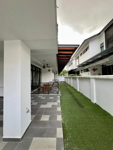 Exterior type: detached bungalow; features: covered patio area, slate tile flooring, manicured lawn, white painted facade, overhanging roof with wooden beams, fenced perimeter, side walkway, outdoor lighting fixtures; style: modern.