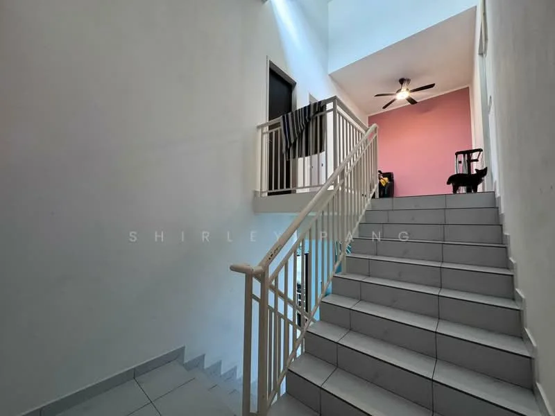 Room features: staircase with white railings, grey tiled flooring, white painted walls, pink accent wall, ceiling fan, natural light from upper windows, doorway leading to rooms, black cat on staircase; style: modern.