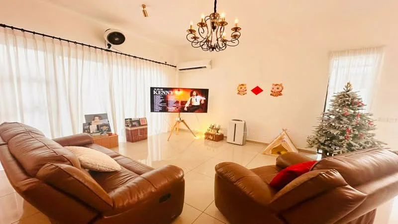 Living features: 2 brown leather recliner sofas, chandelier with multiple bulbs, wall-mounted air conditioning unit, large flat-screen TV on stand, decorative wall art, light-colored walls, cream-colored floor tiles, sheer white curtains, Christmas tree with decorations, wooden play tent, decorative red wall hangings; style: contemporary.