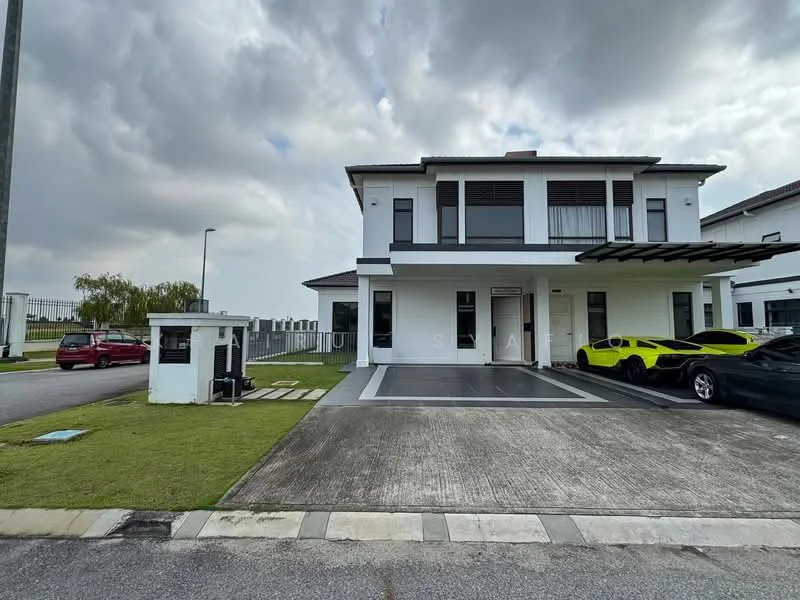 Exterior type: detached bungalow; features: two-storey building, white painted facade, flat roof, manicured lawn, paved driveway, car porch with awning, security guard house at entrance, surrounded by greenery, multiple parking spaces, large windows, covered entrance, modern architectural design; style: modern.
