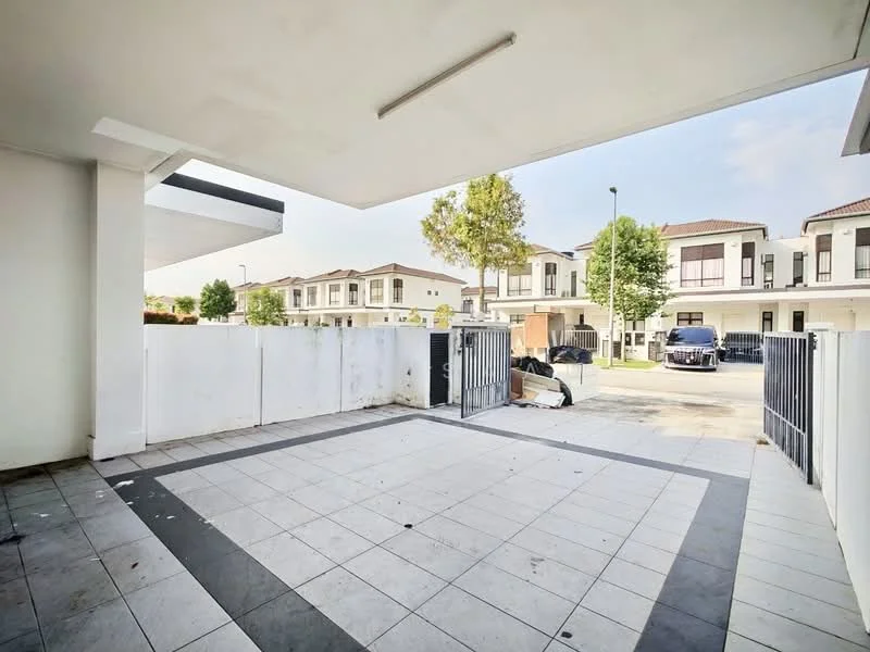 Exterior type: linked terrace house; features: paved driveway, white painted walls, metal gate, surrounding greenery, two-storey houses in background, open space, fenced perimeter, concrete flooring; style: modern.