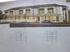 Floor plan: 4-bedroom 3-bathroom unit; features: open-plan kitchen-dining-living, master bedroom with ensuite bathroom, balcony off living room, utility room, double-volume car porch, central foyer, all bedrooms with windows, laundry area.