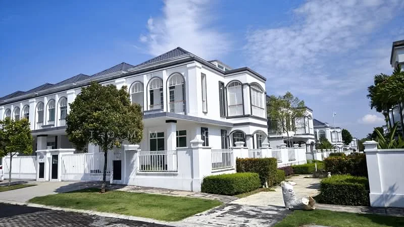 Exterior type: linked terrace house; features: white painted facade, arched windows, flat roof, manicured lawn, mature trees, stone-paved walkway, fenced front yard, balconies on upper floors, driveway with interlocking pavers; style: modern.