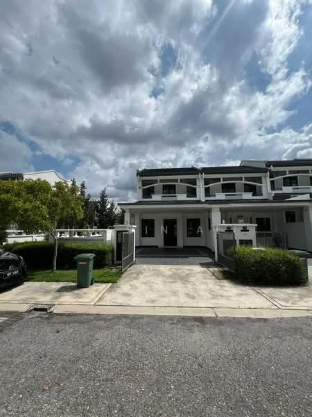 Exterior type: linked terrace house; features: white painted facade, double-storey, flat roof, manicured lawn, paved driveway, front porch, green waste bin, surrounded by greenery, clear blue sky, cloudy weather; style: modern.