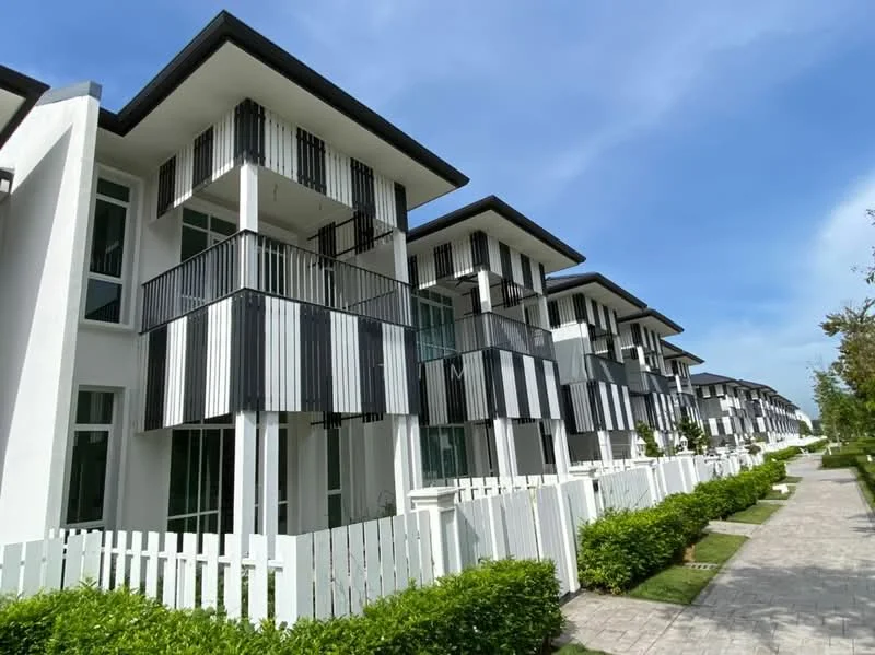 Exterior type: linked terrace house; features: white painted facade, vertical black and white striped balconies, flat roof, approximately 2-storey, manicured lawn, paved walkway, fenced front yard, surrounded by greenery; style: modern.