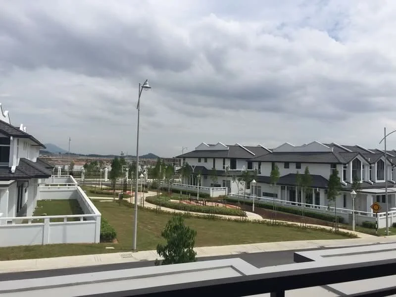 Exterior type: linked terrace house; features: manicured lawn, mature trees, paved pathways, white painted fence, multiple linked houses, gated community, street lighting, landscaped gardens; style: modern.