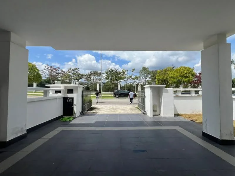 Exterior features: paved driveway, white painted walls, landscaped garden with trees, open entrance, blue sky with clouds, surrounding greenery; style: modern.