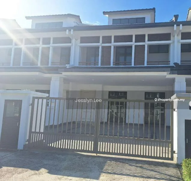 Exterior type: linked terrace house; features: white painted facade, two-storey structure, gated entrance, sliding gate, front porch, large windows, balconies on upper floor, flat roof, concrete driveway, manicured lawn, surrounded by greenery; style: modern.