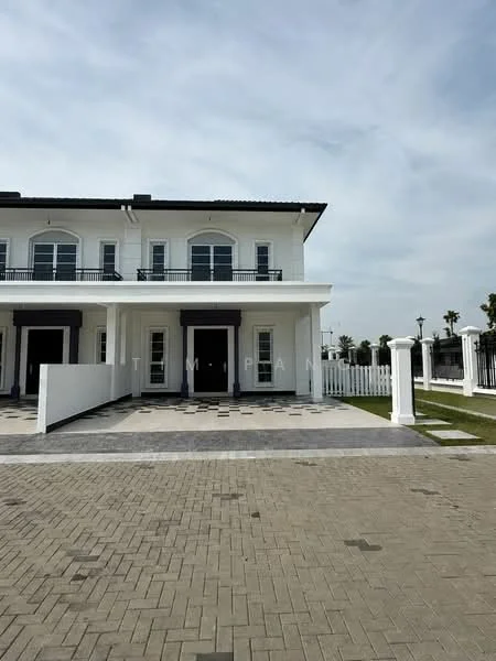 Exterior type: semi-detached house; features: white painted facade, flat roof, double-storey, manicured lawn, paved driveway, fenced perimeter, balconies on upper level, large windows, porch area, landscaped garden, outdoor lighting; style: modern.